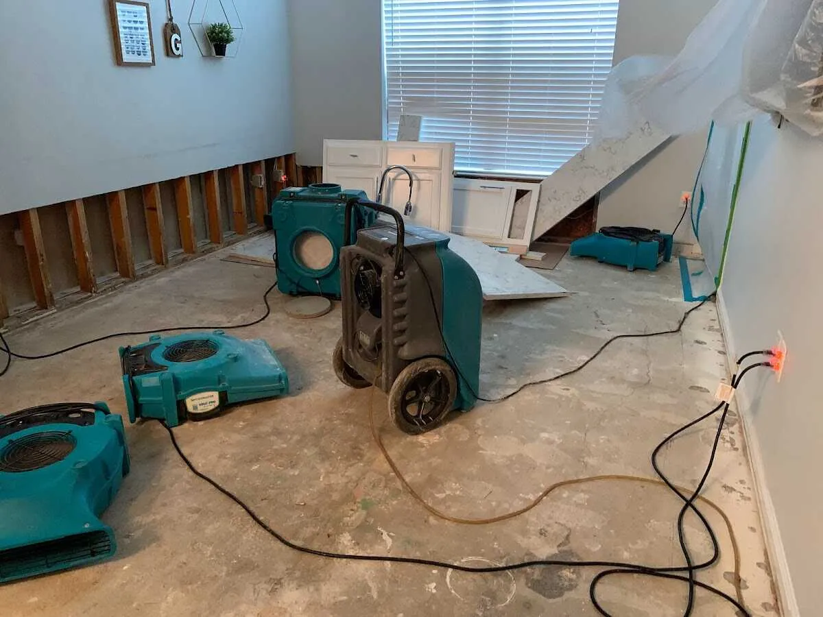Dehumidifier in flood-cut room for Water Damage Restoration in Maize
